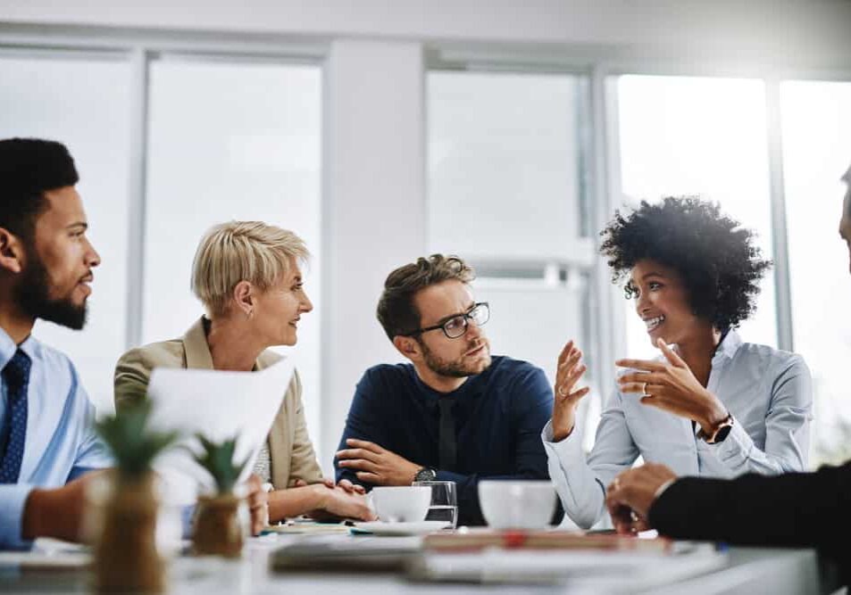 I need everyone to give me their best ideas. Shot of a group of businesspeople sitting together in a meeting. Shot of a group of businesspeople sitting together in a meeting